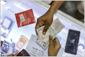 Sources: four consortia, comprised of companies like Reliance, Paytm, Amazon, Fb, Google, and Visa, are preparing bids to operate India's digital payments (Saritha Rai/Bloomberg)